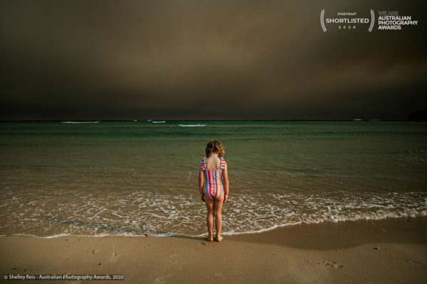 Under smoky skies.
At the height of the bushfire season of 2019-2020, it felt as if the smoke would never clear. After a few months, life resumed as normal and even under the most smoky of skies we went about our day to day lives attempting to salvage some enjoyment and normality out of our summer. Shot on the South Coast of NSW, this portrait represents our summer and what became our eery new normal.
